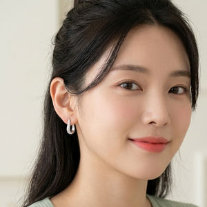 Sparkling Curved Pavé Huggie Earrings in Sterling Silver